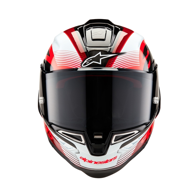 Alpinestars Supertech R-10 Team hiilikuituinen punainen ja valkoinen integraalinen moottoripyöräilykypärä.