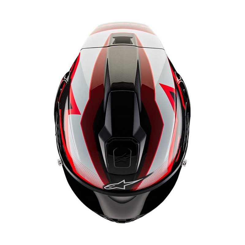Alpinestars Supertech R-10 Team hiilikuituinen punainen ja valkoinen integraalinen moottoripyöräilykypärä.