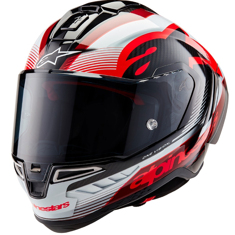 Alpinestars Supertech R-10 Team hiilikuituinen punainen ja valkoinen integraalinen moottoripyöräilykypärä.