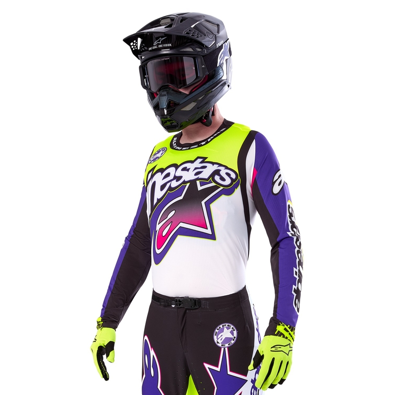 Alpinestars Supertech SX rajoitettu painos Dirt Studios valkoinen-violetti-pinkki-fluokeltainen motocross trikoo