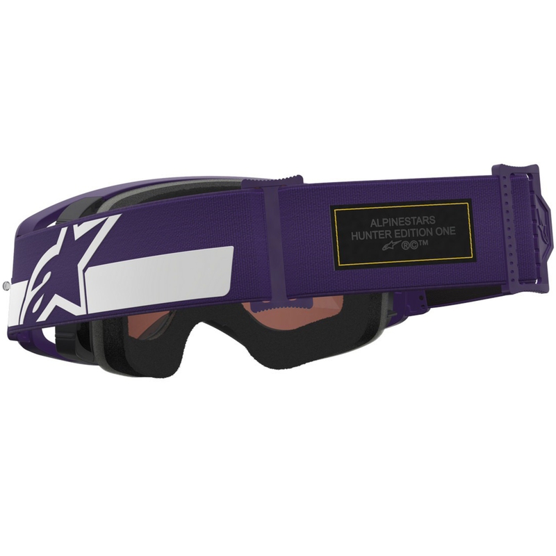Alpinestars Supertech Vision Hunta96 XXV motocross-lasit violetti ja valkoinen peilillä ja hopeisella pleksillä.