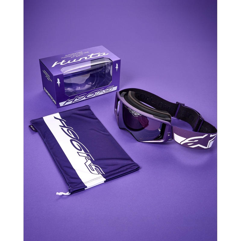 Alpinestars Supertech Vision Hunta96 XXV motocross-lasit violetti ja valkoinen peilillä ja hopeisella pleksillä.